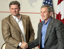 Stephen Harper (left) and George W. Bush