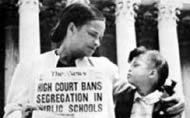 A group of with youths with a pro-segregation banner