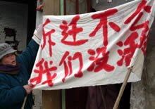 Mr. Wang's wife, putting up her banner