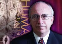Michael Cremo with his book entitled Human Devolution