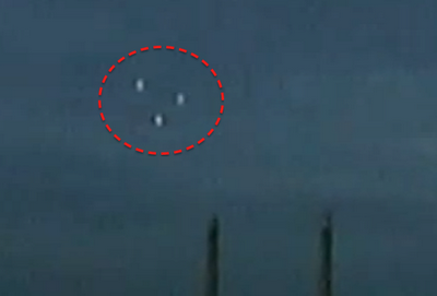 UFOs fly in formation over East London, UK power plant